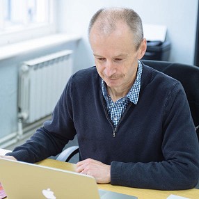 Clive working at his desk